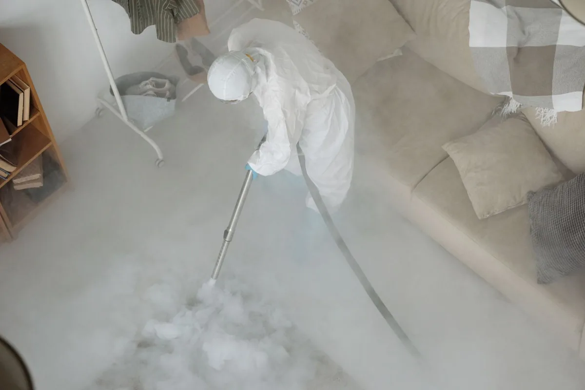 Biohazard cleanup technician in protective equipment, Churchill, OH